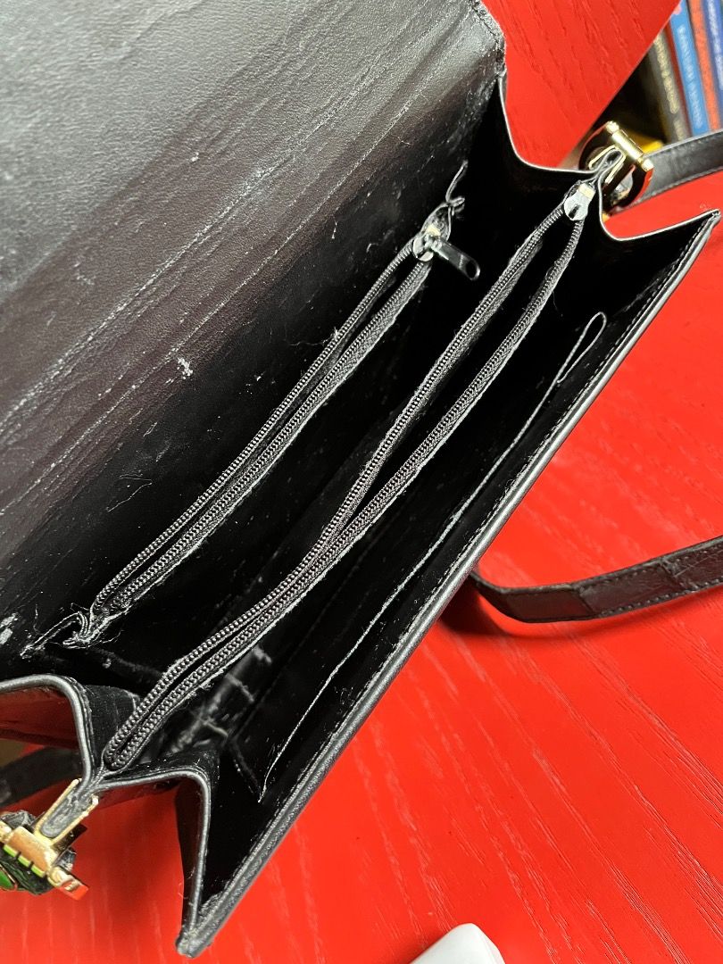 Vintage Black Alligator Skin Shoulder Bag (Category: Shoulder Bags) located in Makati City. Submitted by Ina_Ndang (Listing ID 1470821621, Image 3). Description: Vintage black alligator skin leather shoulder bag Can be used as clutch or evening bag No major flaws but has some rubs and scuffs as expected of a vintage bag. Not powdery inside but has some cracks on leather lining inside. Does not affect functionality. Can fit basic essentials such a