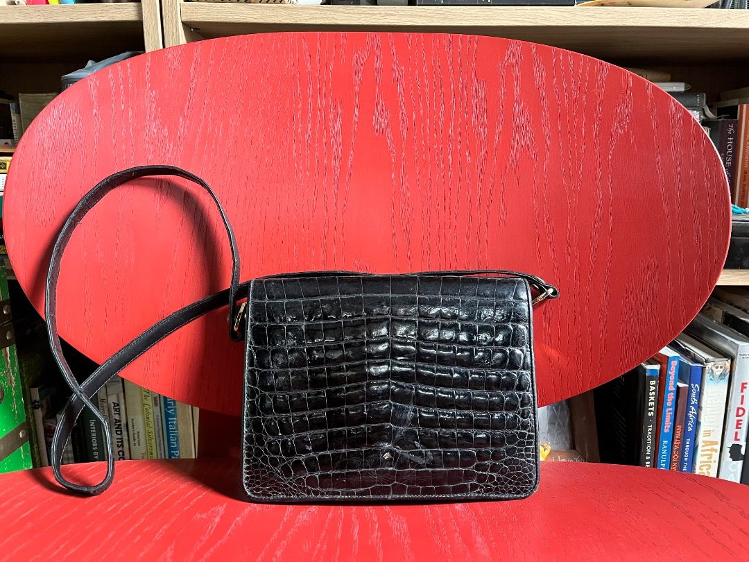 Vintage Black Alligator Skin Shoulder Bag (Category: Shoulder Bags) located in Makati City. Submitted by Ina_Ndang (Listing ID 1470821621, Image 2). Description: Vintage black alligator skin leather shoulder bag Can be used as clutch or evening bag No major flaws but has some rubs and scuffs as expected of a vintage bag. Not powdery inside but has some cracks on leather lining inside. Does not affect functionality. Can fit basic essentials such a