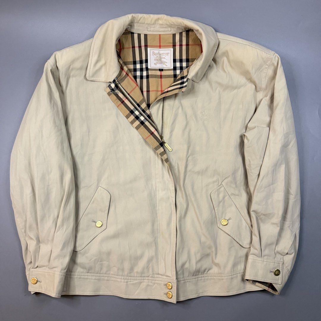 (Vintage) Burberry - Cream Harrington Jacket (Category: Coats, Jackets and Outerwear) located in Paranaque City. Submitted by millennial_goodz (Listing ID 1470906837, Image 1). Description: WTS (Vintage) Burberry - Cream Harrington Jacket Size 2 Dimensions: 24" / 26" -- 21" Sleeves Excellent condition Flaw: Minimal washable stain Authentic DM.