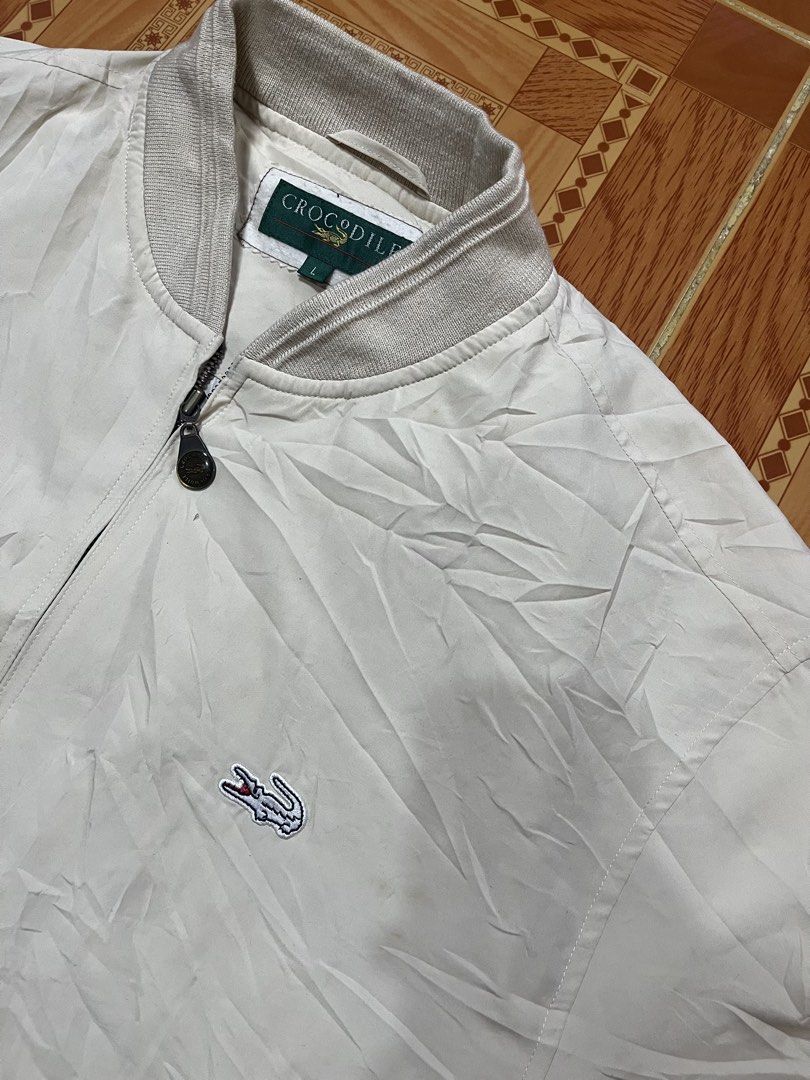 Vintage Crocodile Cream Bomber Jacket Size L (Category: Coats, Jackets and Outerwear) located in Kidapawan. Submitted by azythrift (Listing ID 1470823216, Image 3). Description: - Brand/Model: Authentic Crocodile bomber jacket - Color: Cream 23x27 - Size: L (great for layering) - Details: Classic ribbed collar, cuffs, and hem - Closure: Full zip with custom zipper pull - Branding: Embroidered crocodile logo on the left chest - Pockets: Two front 