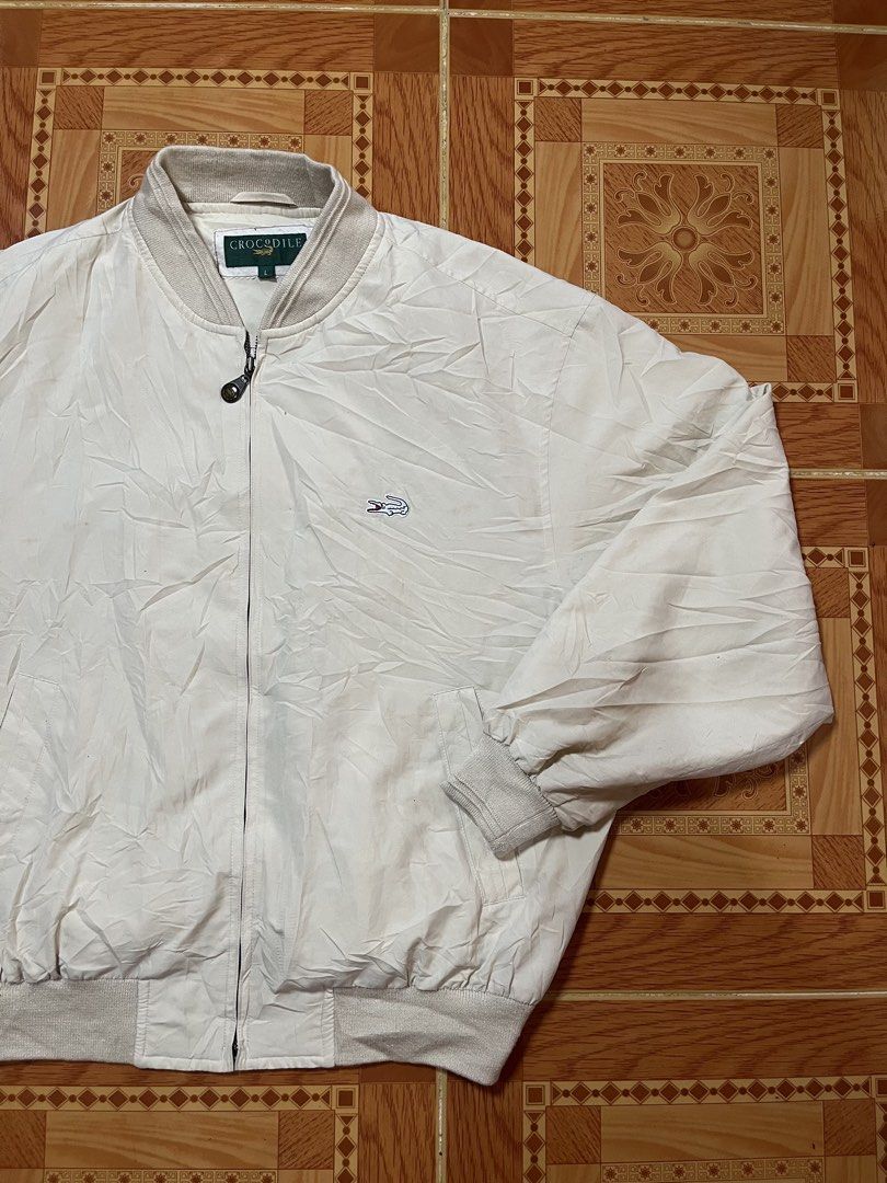 Vintage Crocodile Cream Bomber Jacket Size L (Category: Coats, Jackets and Outerwear) located in Kidapawan. Submitted by azythrift (Listing ID 1470823216, Image 2). Description: - Brand/Model: Authentic Crocodile bomber jacket - Color: Cream 23x27 - Size: L (great for layering) - Details: Classic ribbed collar, cuffs, and hem - Closure: Full zip with custom zipper pull - Branding: Embroidered crocodile logo on the left chest - Pockets: Two front 