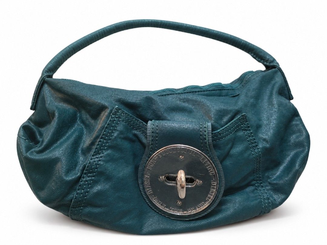 Vintage Diesel Shoulder Bag – Y2K (Category: Shoulder Bags) located in Manila. Submitted by littleclosetfindsmnl (Listing ID 1470900983, Image 1). Description: Authentic vintage-style Diesel shoulder bag with a textured finish and signature circular hardware. Flaw: The surface coating shows signs of wear and flaking. May require professional recoating. 💌 Open to reasonable offers! Feel free to message me for inquiries! 📌 Please Read Before Buyi