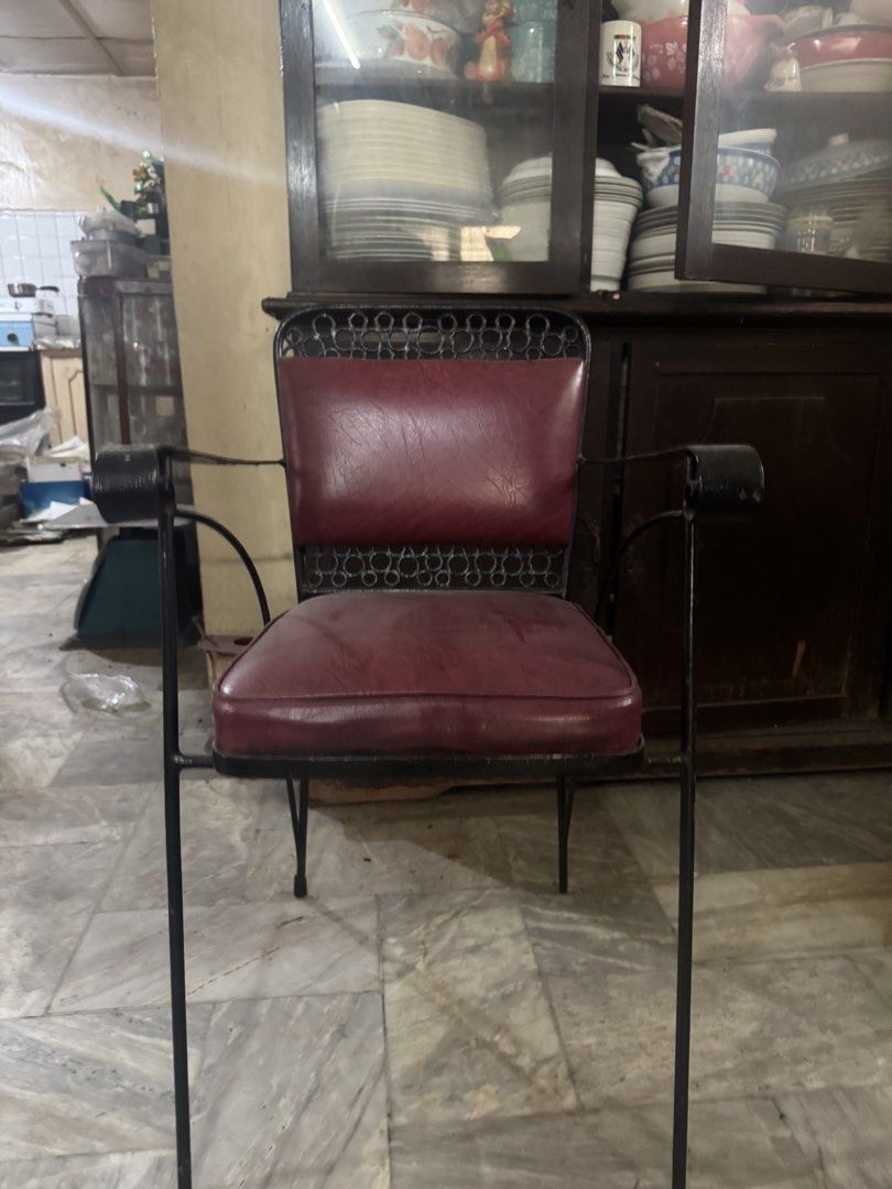 Vintage Glass Top Dining Table and Chairs Set (Category: Tables & Sets) located in Manila. Submitted by jvsou31 (Listing ID 1470885698, Image 2). Description: - Rectangular glass top dining table with a sturdy black metal frame - Elegant decorative circle patterns along the table edge - Includes 6 matching dining chairs upholstered in comfortable dark red vinyl with armrests - Sleek black metal legs on both the table and chairs - Mid-century iron