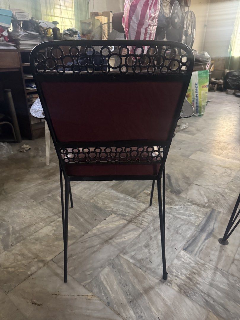 Vintage Glass Top Dining Table and Chairs Set (Category: Tables & Sets) located in Manila. Submitted by jvsou31 (Listing ID 1470885698, Image 3). Description: - Rectangular glass top dining table with a sturdy black metal frame - Elegant decorative circle patterns along the table edge - Includes 6 matching dining chairs upholstered in comfortable dark red vinyl with armrests - Sleek black metal legs on both the table and chairs - Mid-century iron