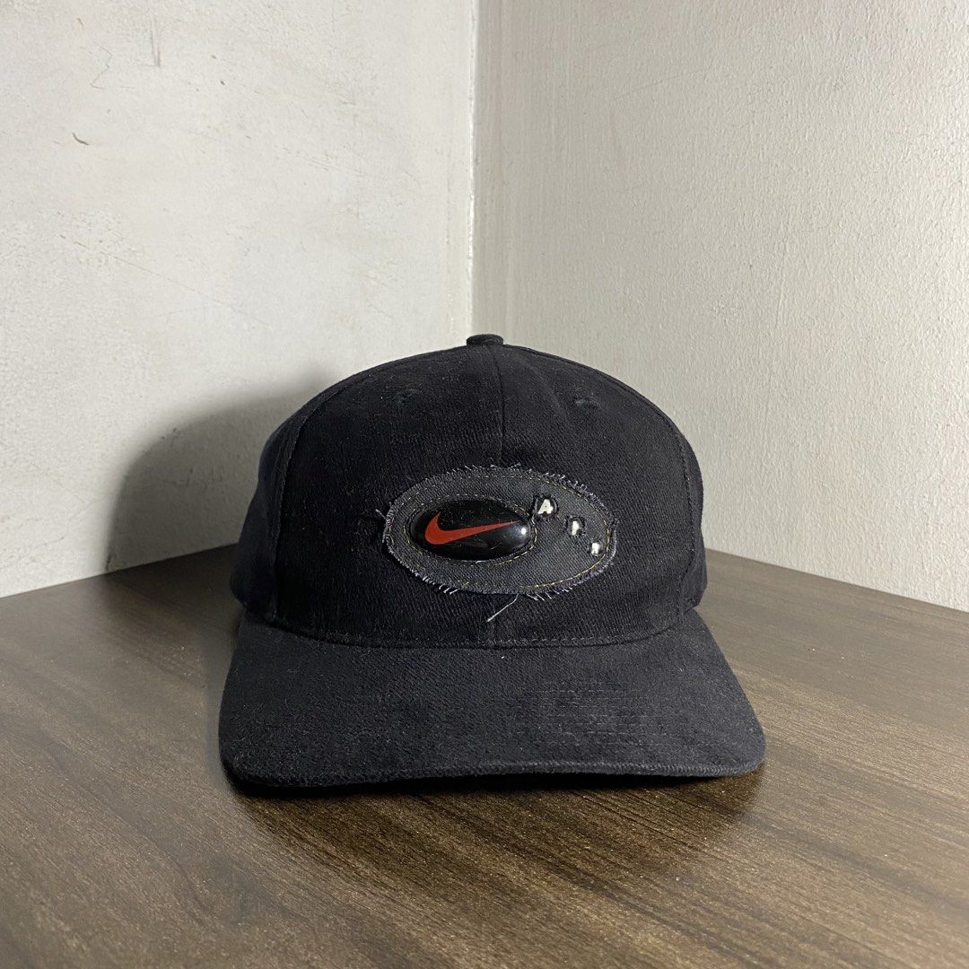 Vintage Nike Air Oval Logo Cap (Category: Caps & Hats) located in Manila. Submitted by curatedvg. (Listing ID 1470846243, Image 2). Description: Vintage Nike Air Oval Logo Cap Adult Fitting Velcro (with swoosh engraved) Free Size Flaws: minor signs of wear Color Rate: 9.5/10 (black) Condition: LIGHTLY USED COLOR MAY VARY DUE TO LIGHTING! Helping a friend ❗️.