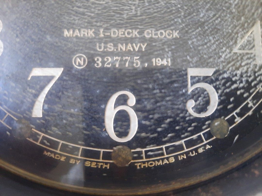 Vintage Seth Thomas U.S. Navy Mark I Deck Clock 1941 (Category: Vintage Collectibles) located in Marilao. Submitted by mariealeiah (Listing ID 1470748612, Image 2). Description: - Authentic 1941 U.S. Navy Mark I deck clock by Seth Thomas - Serial Number: 32775 - Design: Classic black round casing with white numbering and top sub-dial - Condition: Shows authentic age-related wear and crazing on the dial face - Inclusions: Original winding key and 