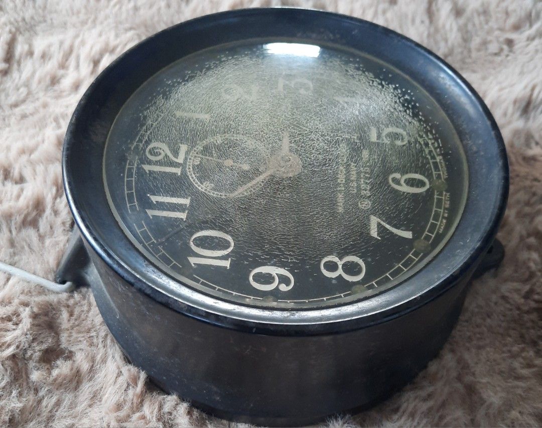 Vintage Seth Thomas U.S. Navy Mark I Deck Clock 1941 (Category: Vintage Collectibles) located in Marilao. Submitted by mariealeiah (Listing ID 1470748612, Image 3). Description: - Authentic 1941 U.S. Navy Mark I deck clock by Seth Thomas - Serial Number: 32775 - Design: Classic black round casing with white numbering and top sub-dial - Condition: Shows authentic age-related wear and crazing on the dial face - Inclusions: Original winding key and 