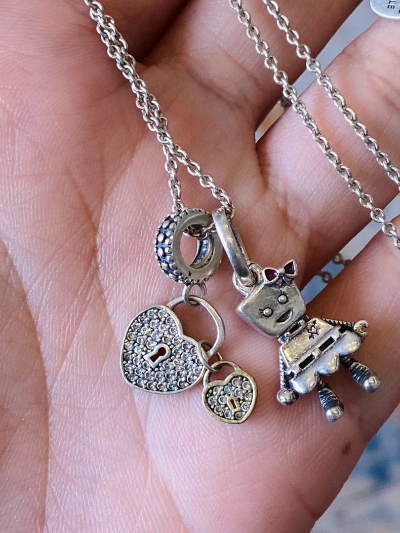 VINTAGE SILVER WITH CHARMS NECKLACE (Category: Necklaces) located in Baguio. Submitted by asna_taku (Listing ID 1470819452, Image 2). Description: ✨ VINTAGE SILVER WITH CHARMS NECKLACE ✨🔐💖 A charming and playful vintage treasure featuring adorable dangling charms, including a sparkling heart-shaped padlock, a dainty mini lock, and a cute little girl figure! 💕 Beautifully crafted in silver with intricate details, this unique necklace brings a t