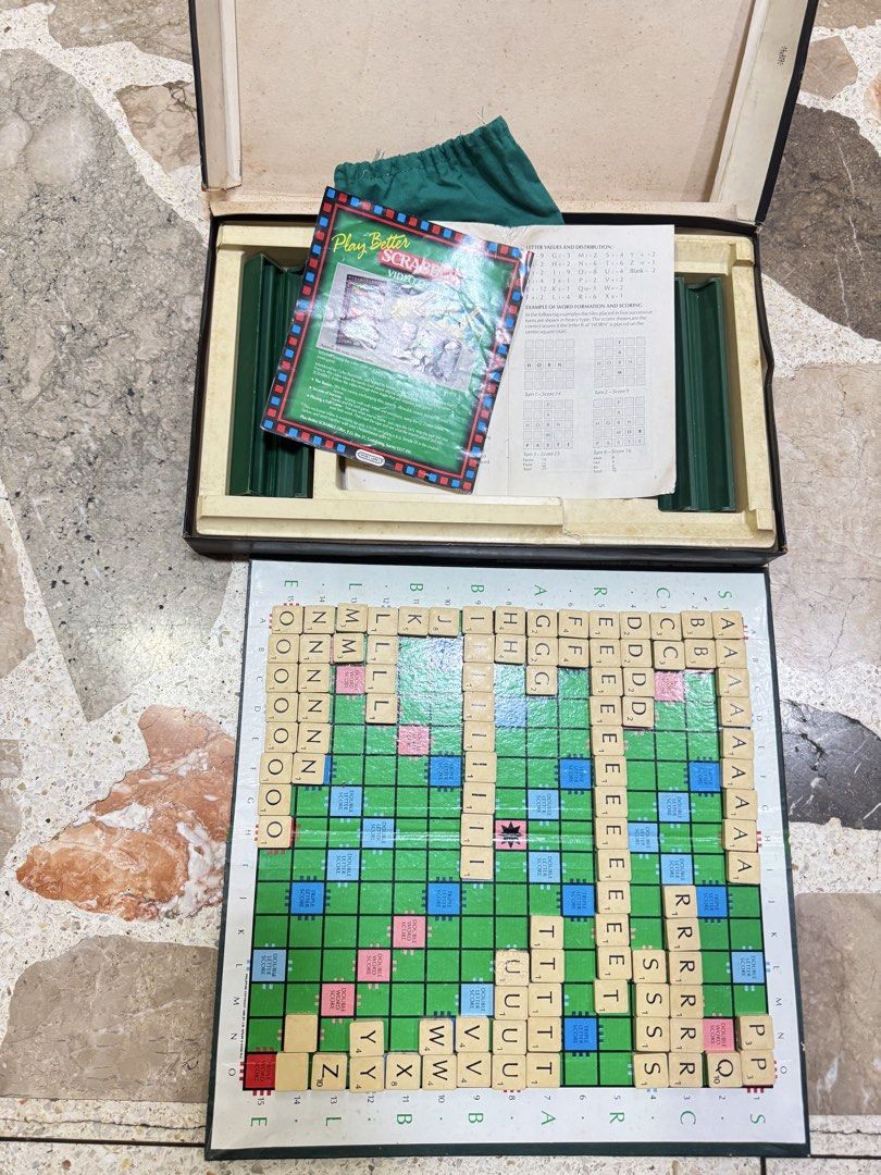 Vintage Spear's Games Scrabble Board Game Set (Category: Board Games & Puzzles) located in Las Pinas. Submitted by emdjss (Listing ID 1470790571, Image 2). Description: - Vintage Spear's Scrabble board game - Includes game board, wooden letter tiles, and letter racks - Comes with green storage pouch, rule book, and Play Better Scrabble leaflet - All components pack neatly into the original box - Perfect for game nights or collectors.