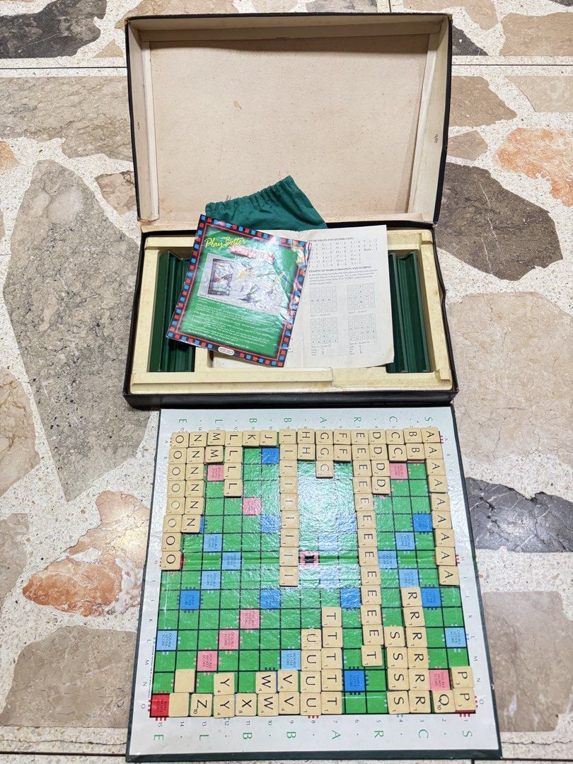 Vintage Spear's Games Scrabble Board Game Set (Category: Board Games & Puzzles) located in Las Pinas. Submitted by emdjss (Listing ID 1470790571, Image 1). Description: - Vintage Spear's Scrabble board game - Includes game board, wooden letter tiles, and letter racks - Comes with green storage pouch, rule book, and Play Better Scrabble leaflet - All components pack neatly into the original box - Perfect for game nights or collectors.