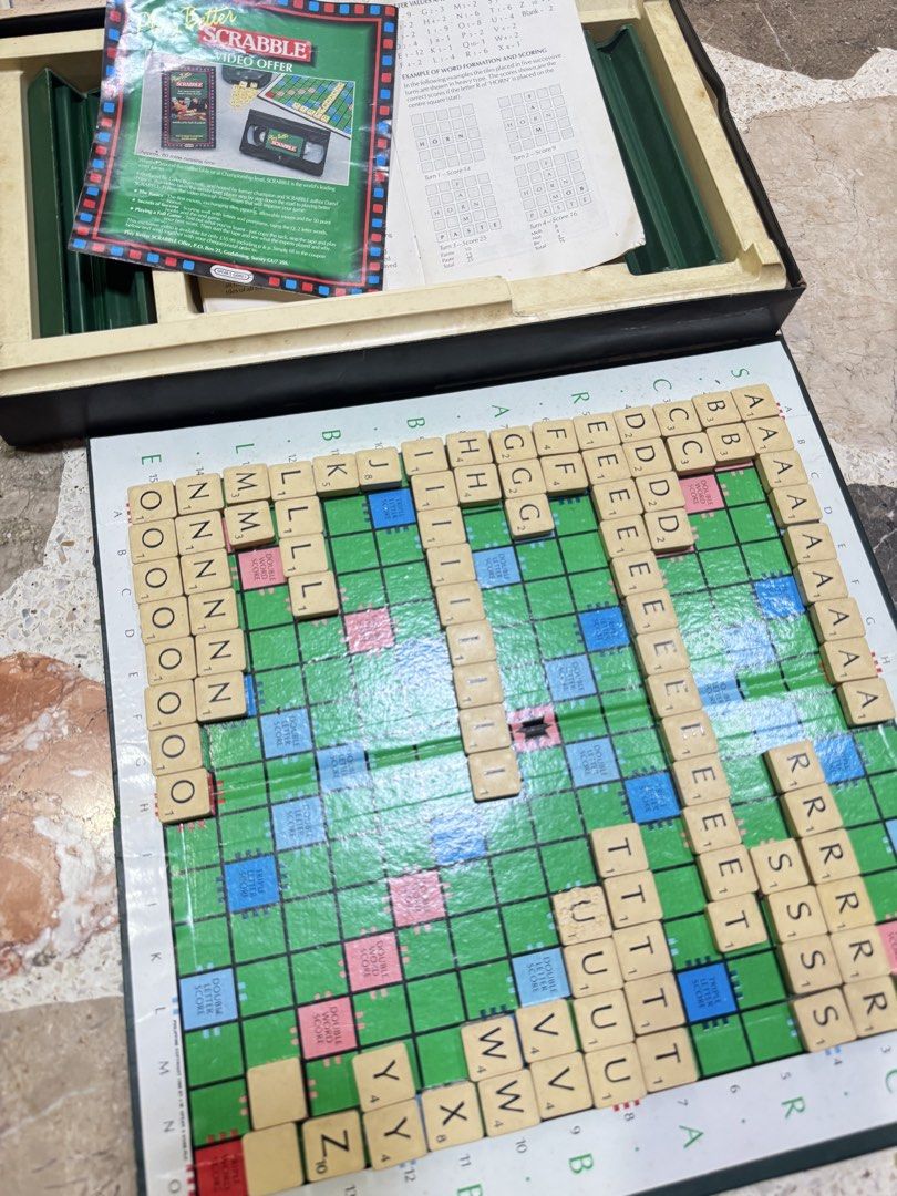 Vintage Spear's Games Scrabble Board Game Set (Category: Board Games & Puzzles) located in Las Pinas. Submitted by emdjss (Listing ID 1470790571, Image 3). Description: - Vintage Spear's Scrabble board game - Includes game board, wooden letter tiles, and letter racks - Comes with green storage pouch, rule book, and Play Better Scrabble leaflet - All components pack neatly into the original box - Perfect for game nights or collectors.