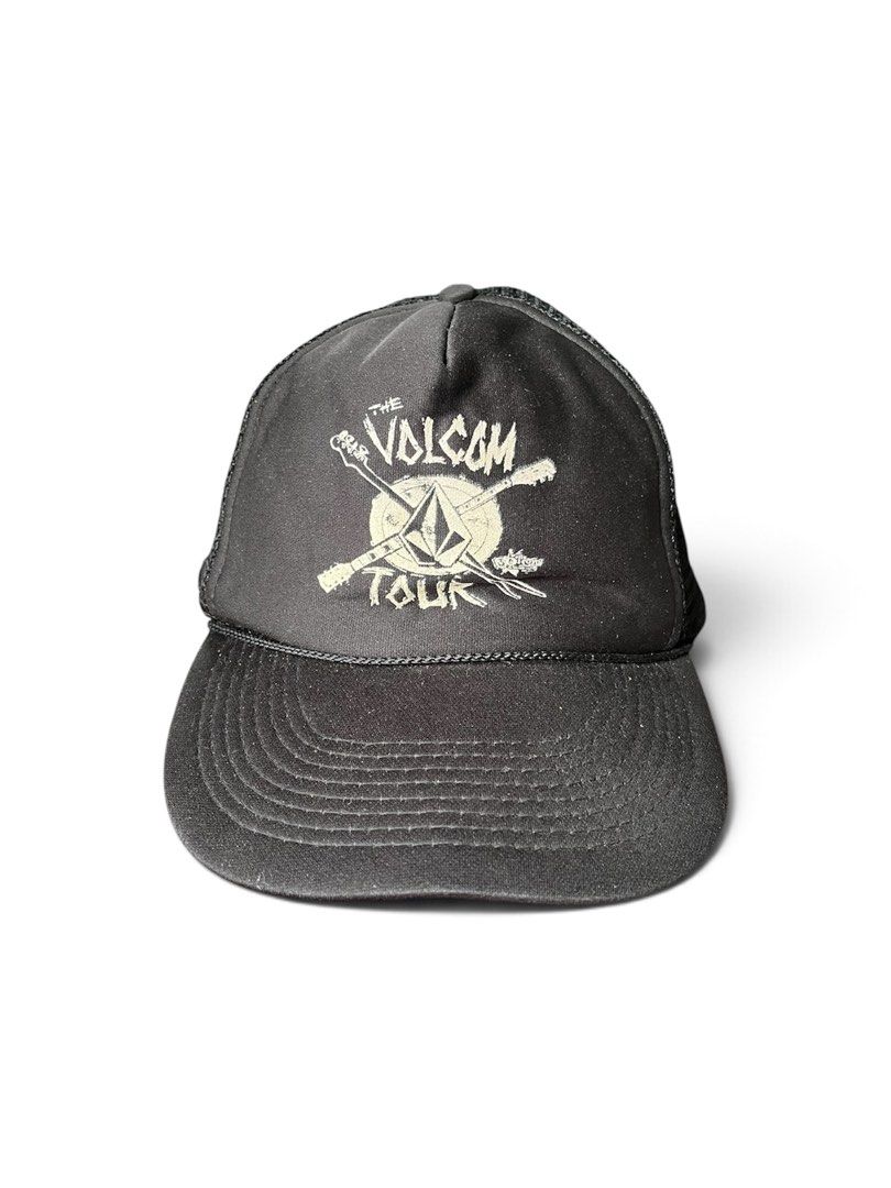 Vintage Volcom Tour Trucker Hat Otto Snapback (Category: Caps & Hats) located in Nabua. Submitted by lastthrift2.0 (Listing ID 1470873328, Image 1). Description: •Vintage condition - Style: Black trucker hat with mesh back panels for breathability - Design: Volcom Tour graphic printed on the front - Closure: Adjustable plastic snapback with Otto branding - Condition: Yellowing on the inside foam lining from age and wear; faded and stained inner t