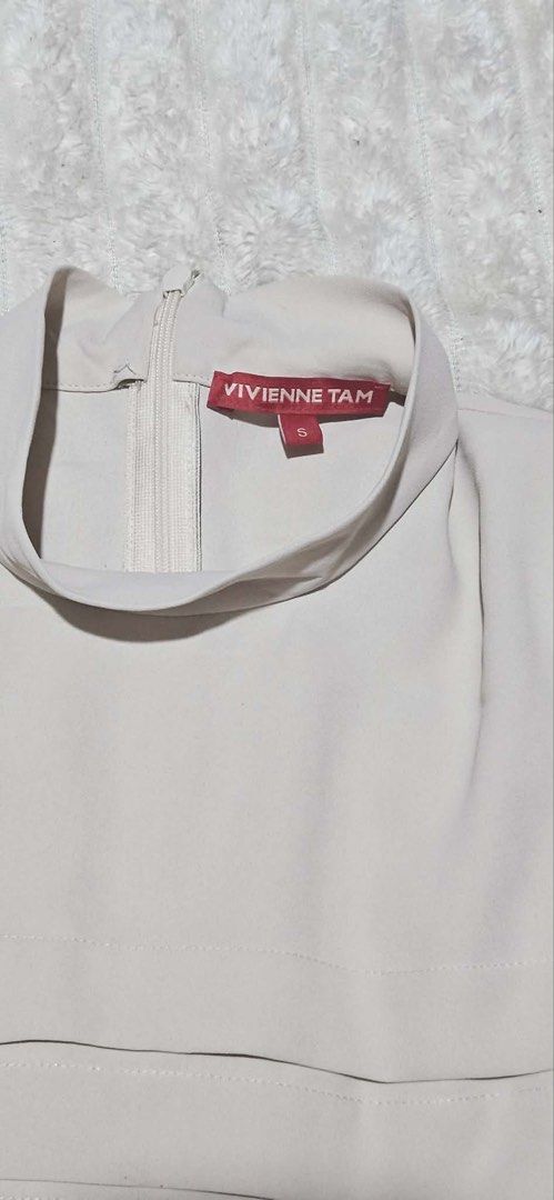Vivienne Tam Long Sleeves Top (Category: Longsleeves) located in Caloocan City. Submitted by bea_d_ (Listing ID 1470768890, Image 2). Description: VIVIENNE TAM High-Neck Long Sleeve Blouse Elegant designer top featuring subtle horizontal pin-tuck / pleated front panel detailing, a chic mock high-neck collar with a back zipper closure, and structured shoulder accents. Perfect for office wear, formal occasions, or elevated casual styling. • Brand: 