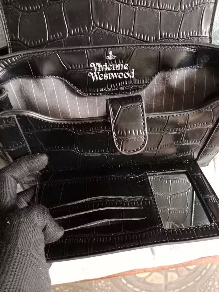 Vivienne Westwood croc (Category: Wallets & Card holders) located in Angeles City. Submitted by mjshoppingretail (Listing ID 1470856328, Image 3). Description: orig Vivienne Westwood like new.