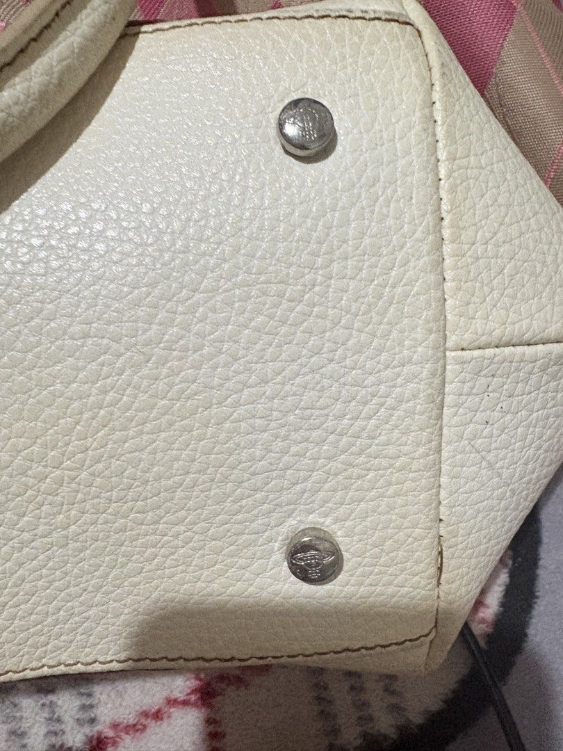 Vivienne Westwood Pink Argyle Handbag (Category: Luxury Bags & Wallets) located in Manila. Submitted by theyenvytracyy (Listing ID 1470773385, Image 3). Description: - Pink and beige argyle pattern fabric bag - White textured leather straps and corner patches - Iconic silver orb logo on the front - Double handle design with silver-tone hardware rings - Handbag is sold - Very unique print and colorway - Clean inside and out, ready to use.