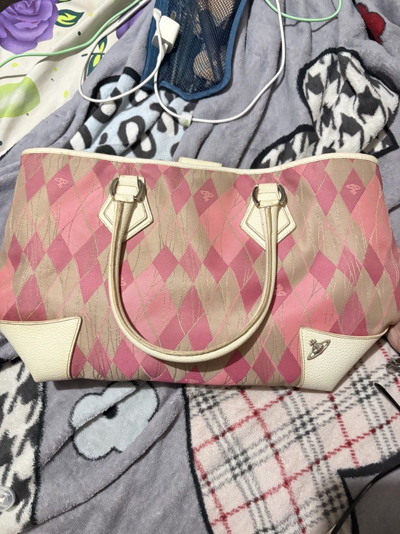 Vivienne Westwood Pink Argyle Handbag (Category: Luxury Bags & Wallets) located in Manila. Submitted by theyenvytracyy (Listing ID 1470773385, Image 2). Description: - Pink and beige argyle pattern fabric bag - White textured leather straps and corner patches - Iconic silver orb logo on the front - Double handle design with silver-tone hardware rings - Handbag is sold - Very unique print and colorway - Clean inside and out, ready to use.