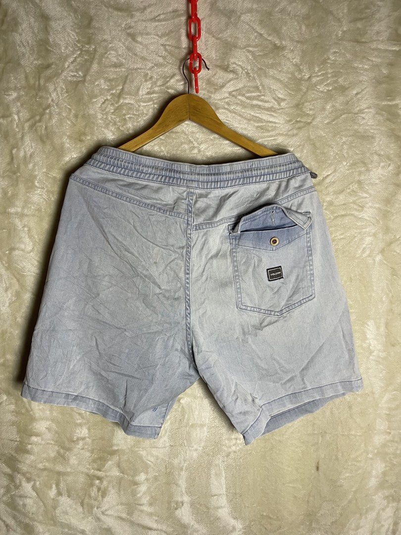 Volcom Light Blue Denim Drawstring Shorts XL (Category: Shorts) located in Molave. Submitted by charlesthrifter (Listing ID 1470854172, Image 2). Description: - Brand: Volcom - Size: XL - Color: Light Blue - Material: Cotton and elastane blend for stretch and comfort - Waistband: Elastic with a grey patterned drawstring - Pockets: Single back pocket with a button flap - Details: Woven brand patch on the back - Condition: Perfect for everyday casu