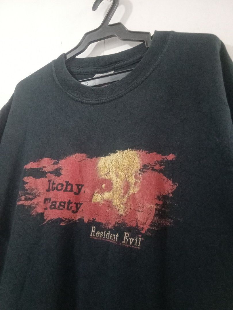 Vtg 2005 resident evil itchy tasty capcom (Category: Vintage Collectibles) located in Santo Tomas. Submitted by rexadominice (Listing ID 1470925872, Image 1). Description: resident evil gaming tee grail item dated 2005 Capcom w19 x L26.5 going 27 see photos Gildan activewear 2 2 2 stitching cut half info tag need wash, penhole hem part sa likod.