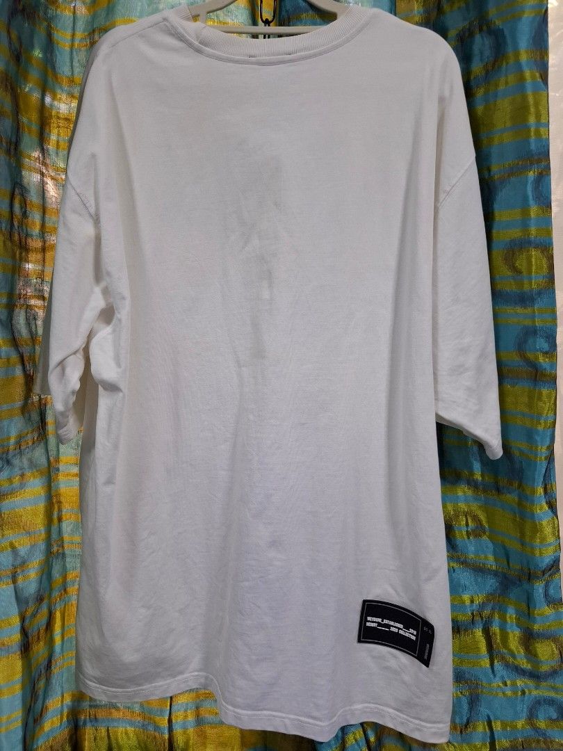 We11done White Repeated Logo T-Shirt (Category: Tshirts & Polo Shirts ) located in Manila. Submitted by jazil.ladyliz (Listing ID 1470764721, Image 2). Description: - Brand: We11done - Color: Clean White - dimes 25x31 - Design: Bold repeated black logo print on front, rubberized 'WE11DONE ESTABLISHED 2015' patch at lower back - Material: Premium heavy cotton for durability and comfort - Fit: Relaxed, streetwear fit - Details: Includes inner woven
