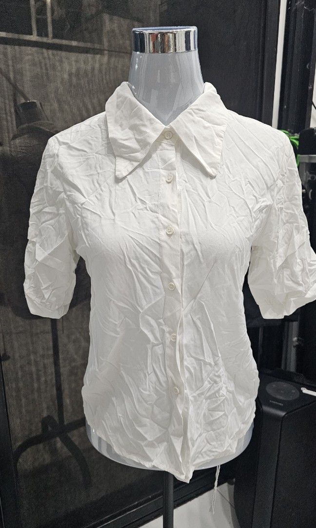 White Button-Down Top (Category: Blouses) located in Manila. Submitted by dndgnzlz (Listing ID 1470847675, Image 1). Description: Brand: Cefang Size: Medium Payment first policy MOP: BPI, Gcash, Maya Courier: LBC, J&T, Lalamove, Grab.