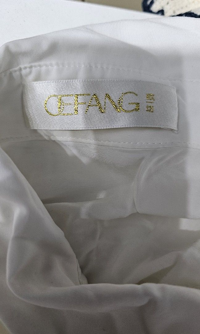 White Button-Down Top (Category: Blouses) located in Manila. Submitted by dndgnzlz (Listing ID 1470847675, Image 2). Description: Brand: Cefang Size: Medium Payment first policy MOP: BPI, Gcash, Maya Courier: LBC, J&T, Lalamove, Grab.