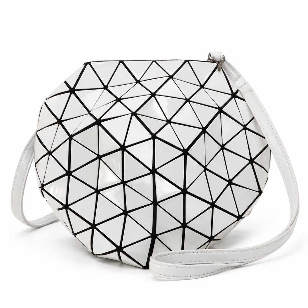 White Geometric Triangle Lattice Crossbody Shoulder Bag (Category: Luxury Bags & Wallets) located in Manila. Submitted by riccalinds06364 (Listing ID 1470849036, Image 1). Description: - Stylish white crossbody bag with eye-catching geometric triangle panels - Features sleek black trim and a glossy, flexible lattice structure - Secure top zipper closure to keep your belongings safe - Includes an adjustable white shoulder strap for comfortable wea