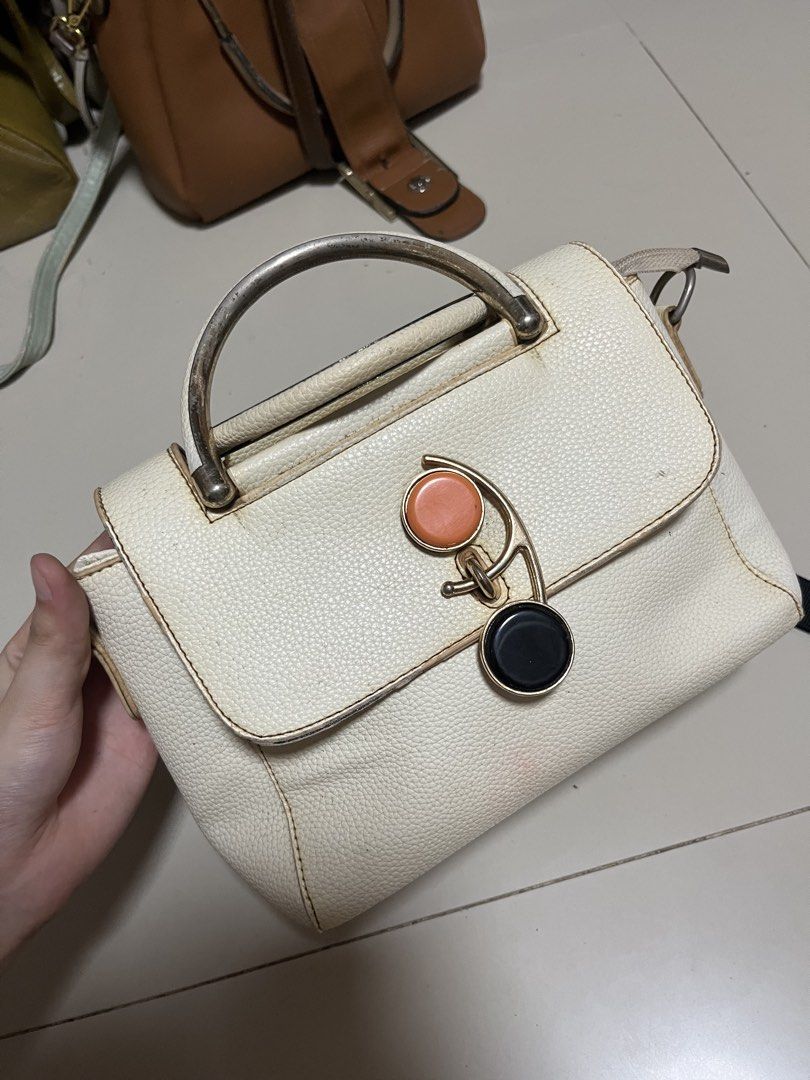 White Handbag with Decorative Lock Charm (Category: Shoulder Bags) located in General Trias. Submitted by walterwhiteyo (Listing ID 1470766007, Image 3). Description: see photos for the details pls!.