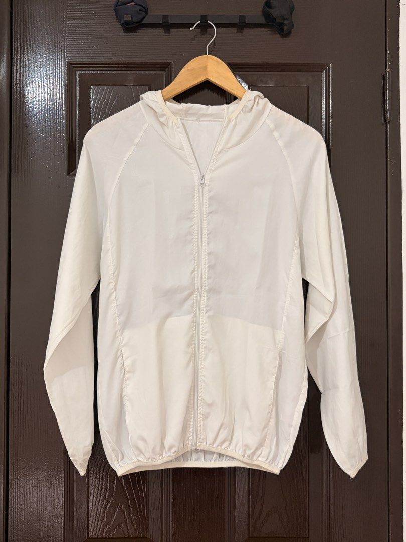 White Lightweight Zip-Up Windbreaker Jacket with Hood (Category: Coats, Jackets and Outerwear) located in Marikina City. Submitted by _bananahanaa (Listing ID 1470802686, Image 1). Description: - Color: White - Lightweight and packable design - Full zip front with matching hood - Two functional front pockets - Elastic cuffs and bottom hem for wind protection - Versatile and easy to layer.