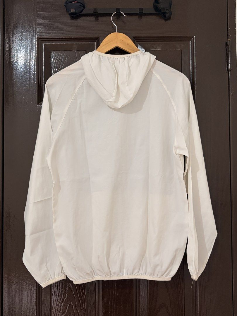 White Lightweight Zip-Up Windbreaker Jacket with Hood (Category: Coats, Jackets and Outerwear) located in Marikina City. Submitted by _bananahanaa (Listing ID 1470802686, Image 2). Description: - Color: White - Lightweight and packable design - Full zip front with matching hood - Two functional front pockets - Elastic cuffs and bottom hem for wind protection - Versatile and easy to layer.