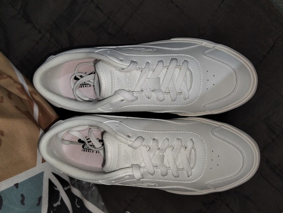 White low-top sneakers (Category: Sneakers) located in Manila. Submitted by elo_blue (Listing ID 1470851053, Image 2). Description: - bought from world balance official online shop, original price is 1,700 - use atleast 10 times already, not use much due to its size - rfs. the size is big for me.