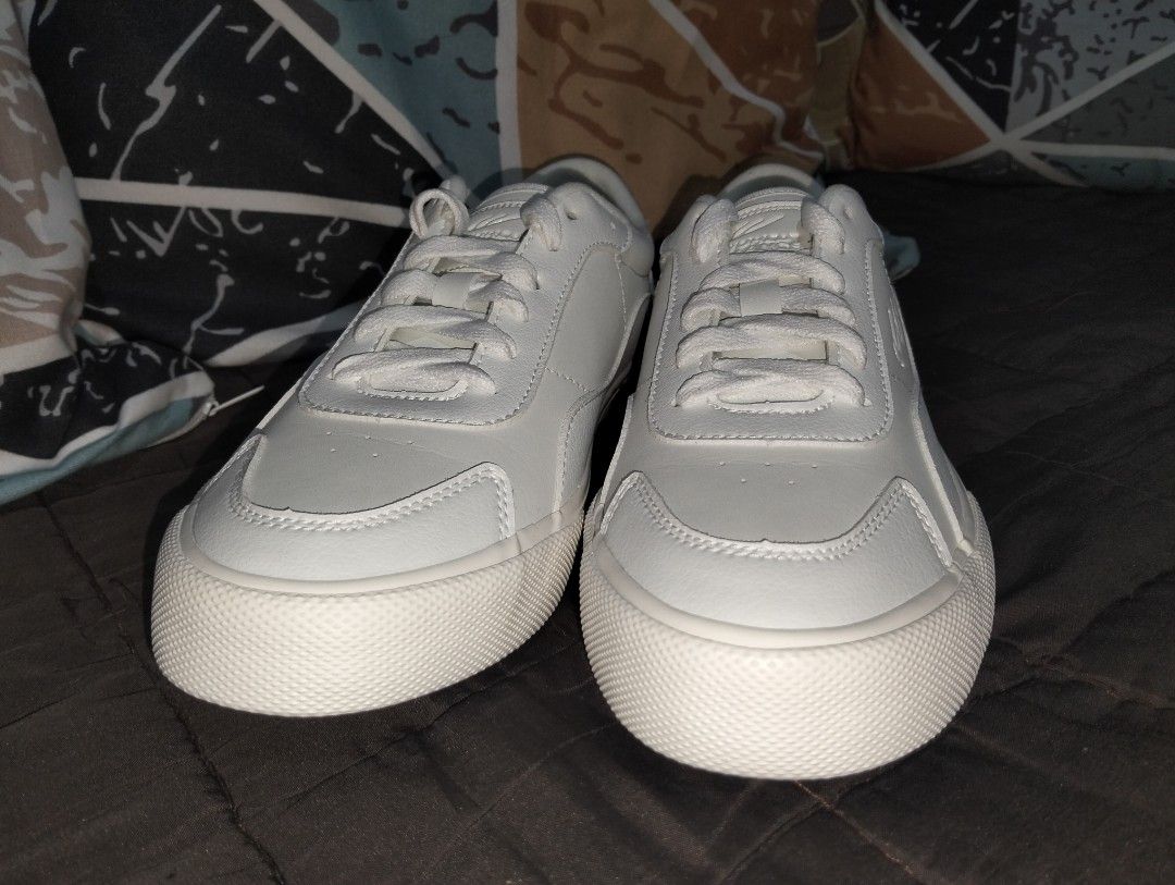 White low-top sneakers (Category: Sneakers) located in Manila. Submitted by elo_blue (Listing ID 1470851053, Image 3). Description: - bought from world balance official online shop, original price is 1,700 - use atleast 10 times already, not use much due to its size - rfs. the size is big for me.