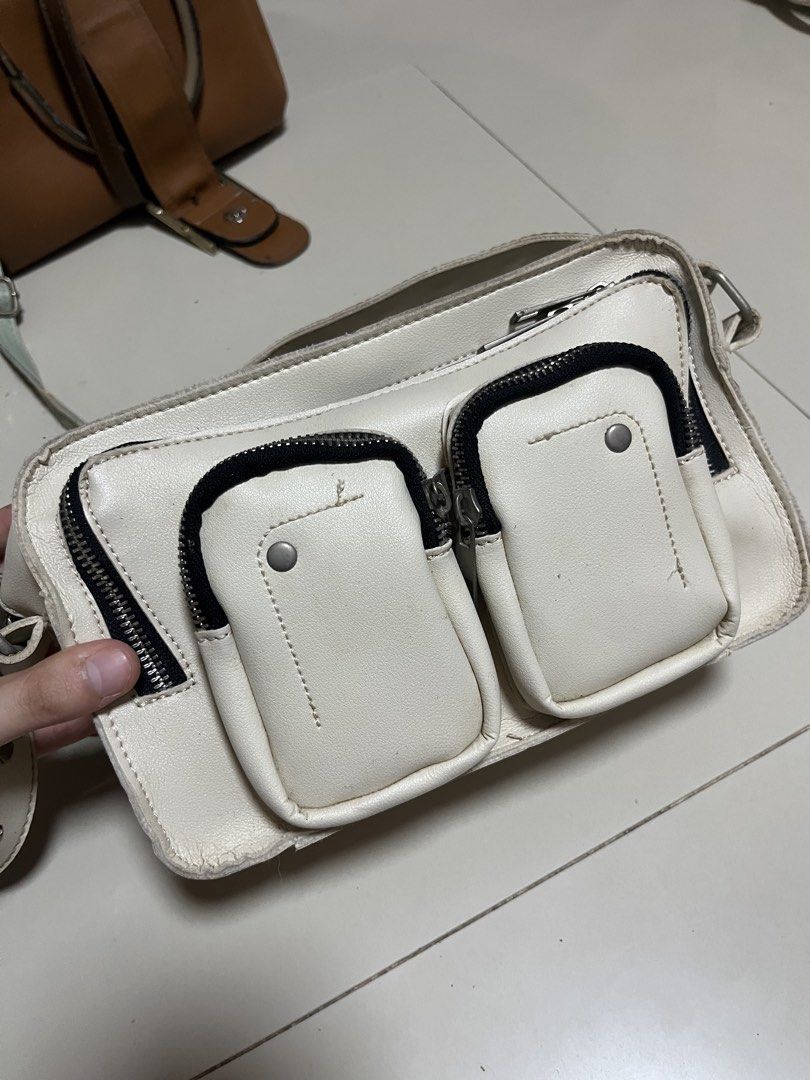 White Multi-Pocket Shoulder Bag with Studded Strap (Category: Shoulder Bags) located in General Trias. Submitted by walterwhiteyo (Listing ID 1470764084, Image 2). Description: see photos for the condition pls!.