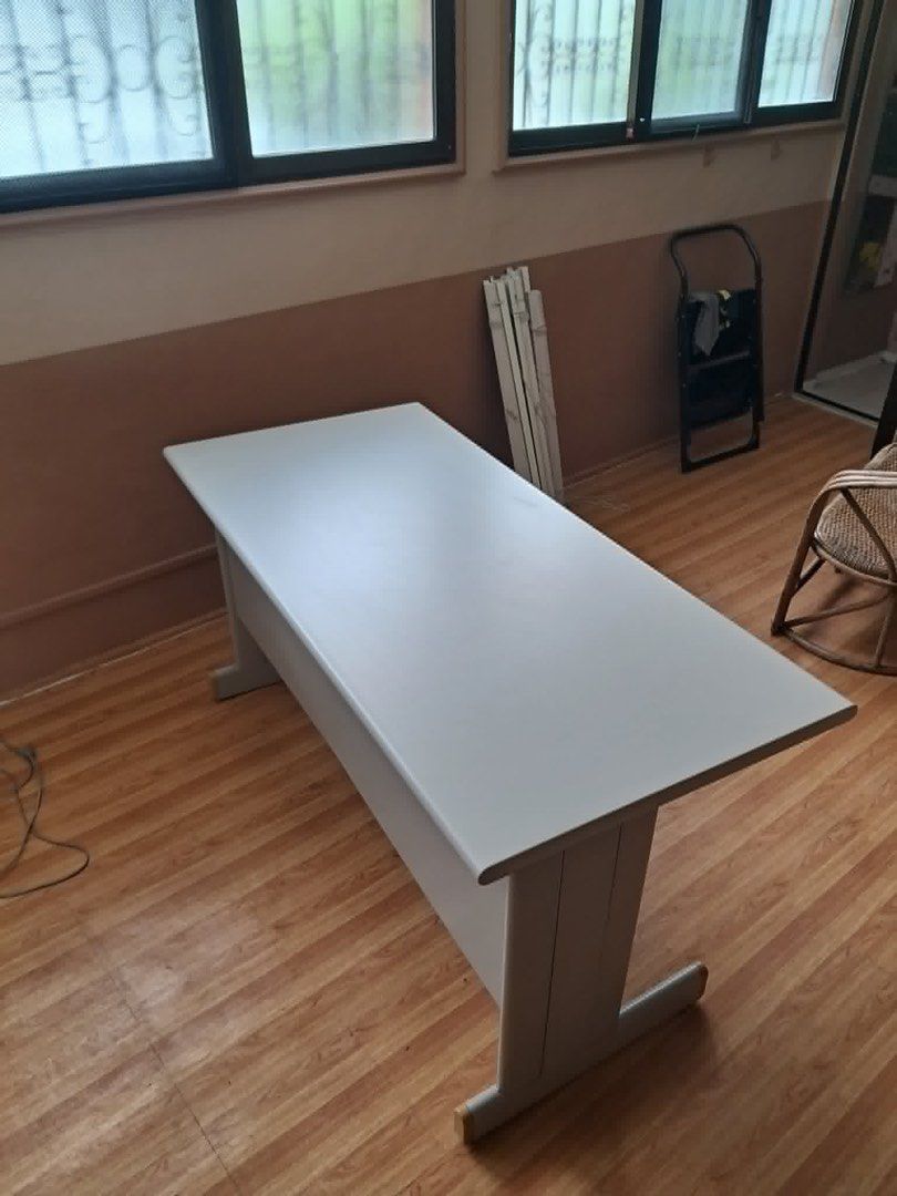 White Office Desk Study Table T-Leg (Category: Office Furniture & Fixtures) located in Quezon City. Submitted by nook19 (Listing ID 1470931372, Image 3). Description: - Color/Design: Clean, minimalist white top with sturdy grey T-shaped legs - Build: Solid, heavy-duty construction - Comfort: Spacious rectangular work surface with plenty of legroom underneath - Ideal for: Home office, study room, or general workspace setup - Fulfillment: Pick up o