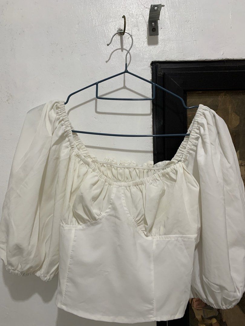 White Puff/Baloon Sleeved Cropped Blouse (Category: Blouses) located in Caloocan City. Submitted by jjasss.mn_ (Listing ID 1470753745, Image 1). Description: Features a square neckline Ruffle design at bust part and back Stain around sleeve area is washable. Nakatago lang sa closet kaya naluma, just need to wash, dry and iron. Best if you're looking for white theme occasions outfit.
