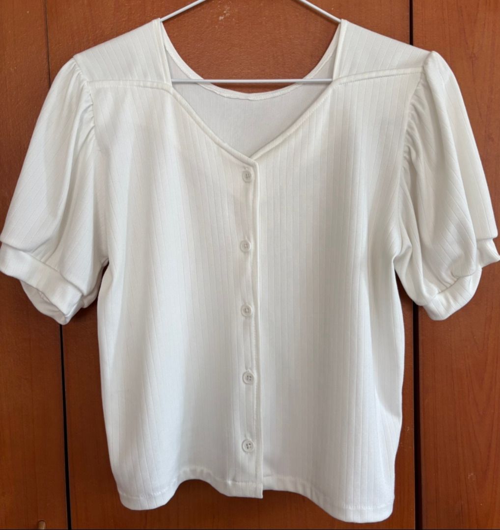 White V-Neck Button-Down Puff-Sleeve Ribbed Top - Medium to Large (Category: Blouses) located in Rizal. Submitted by loveyumiii (Listing ID 1470912974, Image 2). Description: ✨Buy 3 or more items and get a random top for free!!✨ FLAT LAY MEASUREMENTS Shoulder: 15 inches Bust: 18 inches Waist: 17 inches Length: 19 inches ——————————————— SIZE: Medium to Large COLOR: White MATERIAL: Ribbed Stretch Cotton-Poly Blend STYLE: Korean Minimalist / Casual 