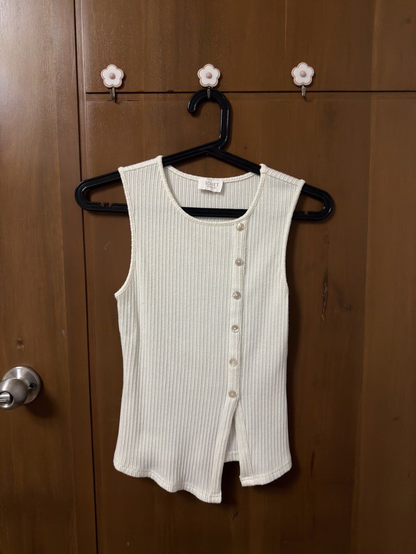 Lovet- White/Cream Ribbed Knit Top with Shell Buttons (Category: Sleeveless) located in Angeles City. Submitted by choctaiyaki (Listing ID 1470903096, Image 1). Description: - knit material - quite heavy - stretchy - no flaws, used with care - dm for inquiries .