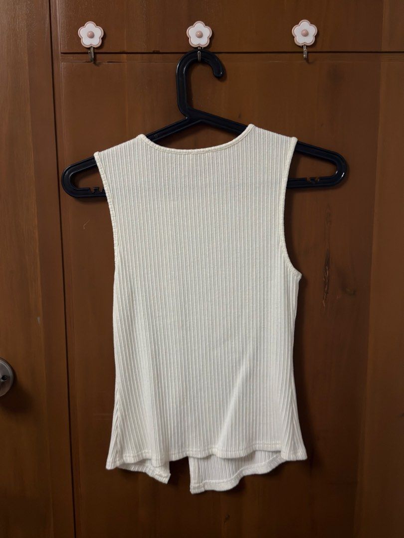 Lovet- White/Cream Ribbed Knit Top with Shell Buttons (Category: Sleeveless) located in Angeles City. Submitted by choctaiyaki (Listing ID 1470903096, Image 2). Description: - knit material - quite heavy - stretchy - no flaws, used with care - dm for inquiries .