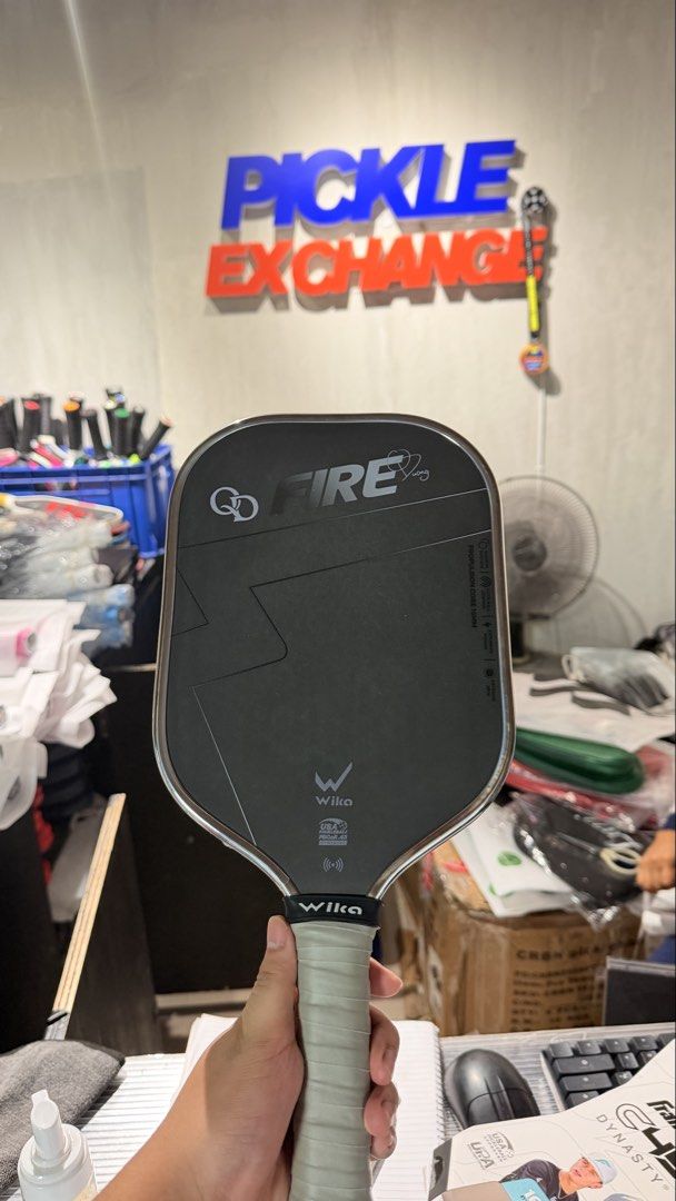 Wika QD Fire 1 SILVER (Category: Racket and Ball Sports) located in San Fernando. Submitted by espiritujed45 (Listing ID 1470815145, Image 2). Description: - Brand: Wika QD Fire 1 Pickleball Paddle - Color: Silver with a grey wrapped handle - Included: Matching black protective zip cover with yellow Wika logo - Condition: USED -BOUGHT AT PICKLE EXCHANGE Sept 12, 2026 - With Warranty 3 months.