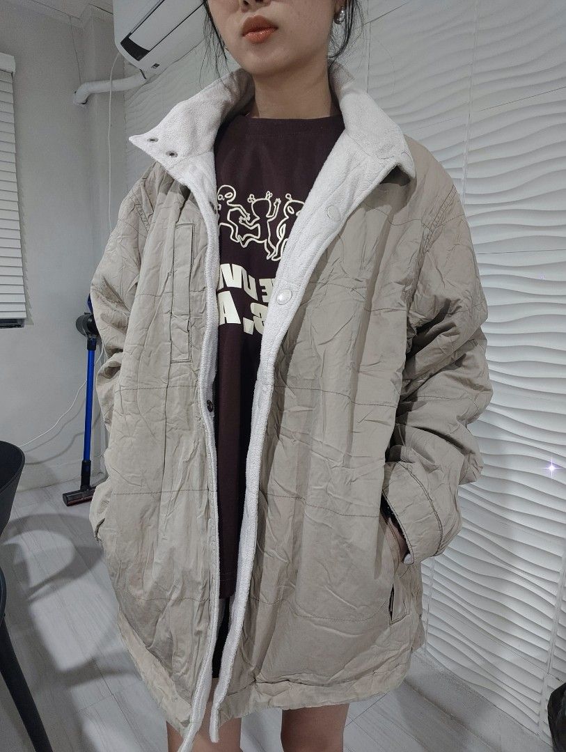 Winter Reversible Quilted Fleece Jacket Beige Off-White (Category: Coats, Jackets and Outerwear) located in Makati City. Submitted by rrraiii (Listing ID 1470886730, Image 1). Description: selling my extra winter / autumn fits ❄️ - Style: Reversible winter jacket with an oversized fit - Side A: Beige quilted fabric - Side B: Off-white fleece - Features: Snap button front closure and deep front pockets - Condition: Great everyday piece, but has a 