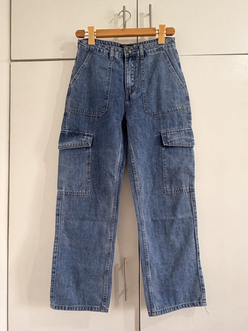 Woman Denim Cargo Jeans Size S (Category: Jeans) located in Marikina City. Submitted by _bananahanaa (Listing ID 1470801538, Image 1). Description: - Brand: Woman Denim - Size: Small - Fit: High-waisted with a straight leg cut - Color/Wash: Classic medium wash - Details: Multiple utility pockets on sides and back - Closure: Button and zipper fly size 28.