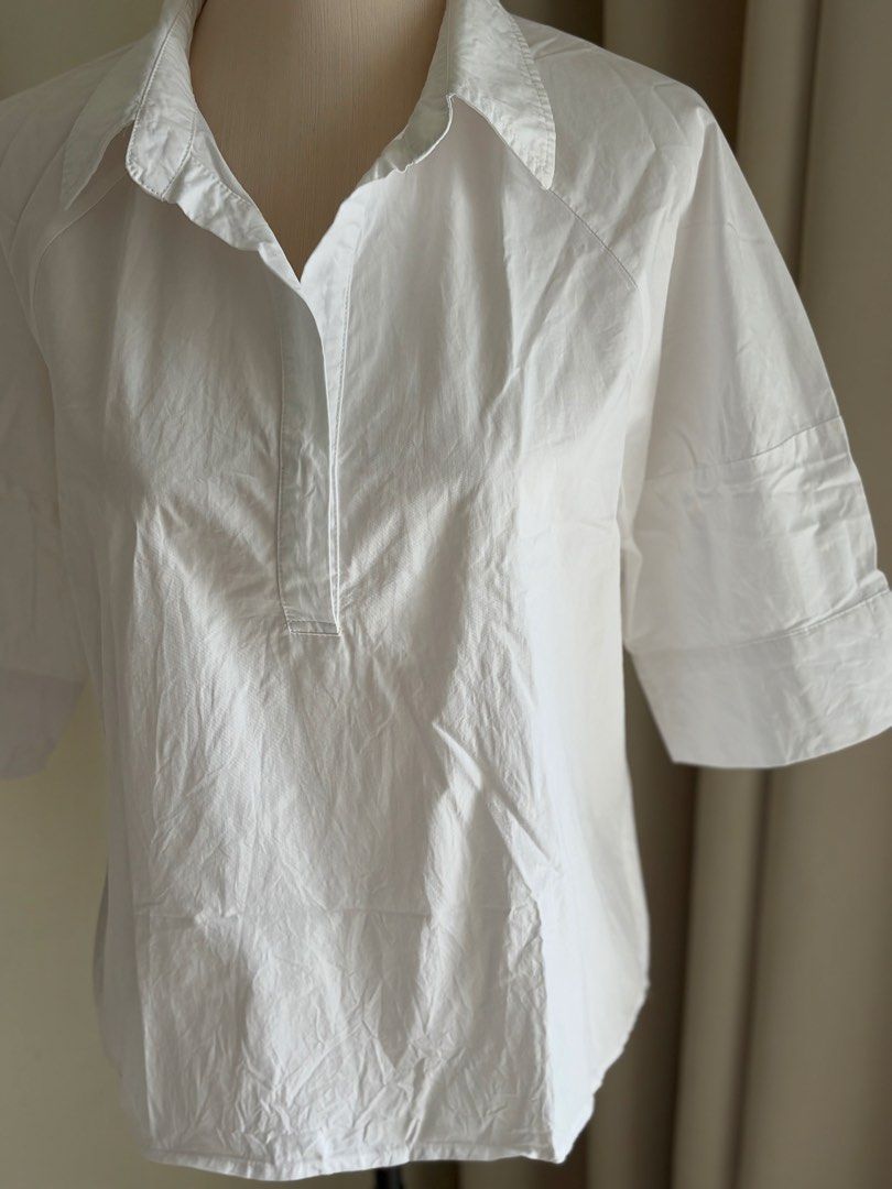 Women’s White Half-Sleeve Blouse (Category: Blouses) located in Manila. Submitted by thecloseteditph (Listing ID 1470860737, Image 2). Description: White half-sleeve blouse. Perfect for office wear, meetings, or casual outings. Never used, just kept in storage. RFS: Bought but never got around to using it..