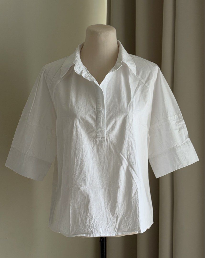 Women’s White Half-Sleeve Blouse (Category: Blouses) located in Manila. Submitted by thecloseteditph (Listing ID 1470860737, Image 1). Description: White half-sleeve blouse. Perfect for office wear, meetings, or casual outings. Never used, just kept in storage. RFS: Bought but never got around to using it..