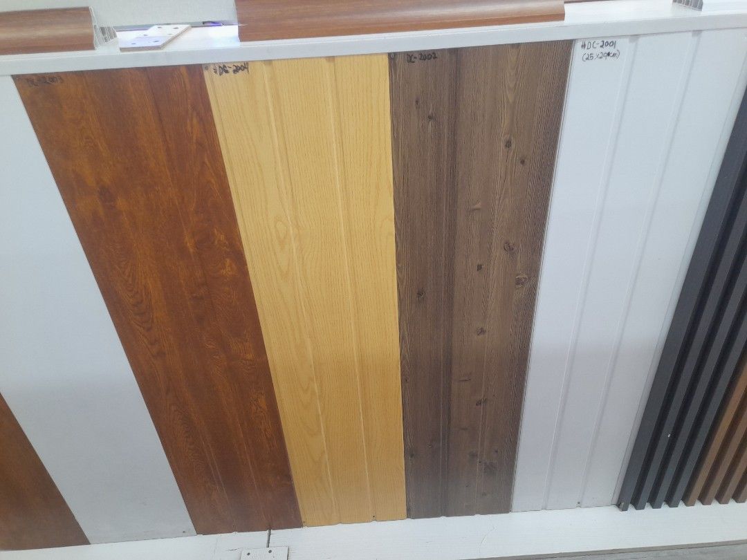 Wood Grain and Solid Color Wall Panels 25x290cm (Category: Wall Decor) located in Manila. Submitted by raquil24 (Listing ID 1470800793, Image 1). Description: - Product: Wall Panel Samples - Available Finishes: Wood grain, plain white, and modern grey - Standard Size: 25x290cm per panel - Best For: Interior accent walls, home renovations, and room updates - Model Numbers: DC-2001, DC-1008, #006, #001 - Condition: Brand new - Shipping/Meet-up: Sen