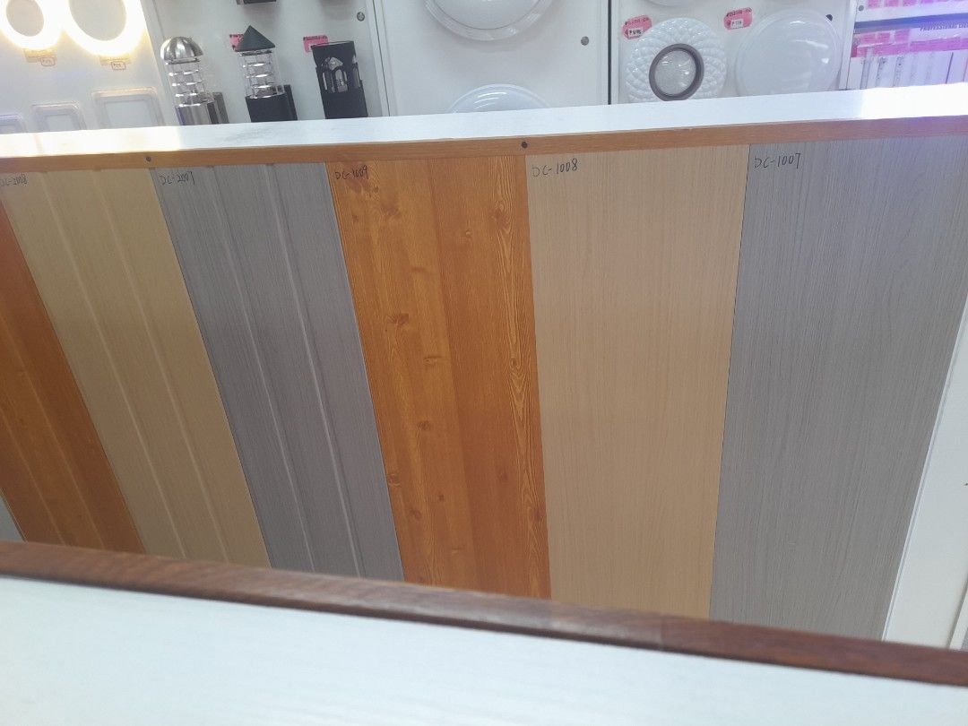 Wood Grain and Solid Color Wall Panels 25x290cm (Category: Wall Decor) located in Manila. Submitted by raquil24 (Listing ID 1470800793, Image 2). Description: - Product: Wall Panel Samples - Available Finishes: Wood grain, plain white, and modern grey - Standard Size: 25x290cm per panel - Best For: Interior accent walls, home renovations, and room updates - Model Numbers: DC-2001, DC-1008, #006, #001 - Condition: Brand new - Shipping/Meet-up: Sen