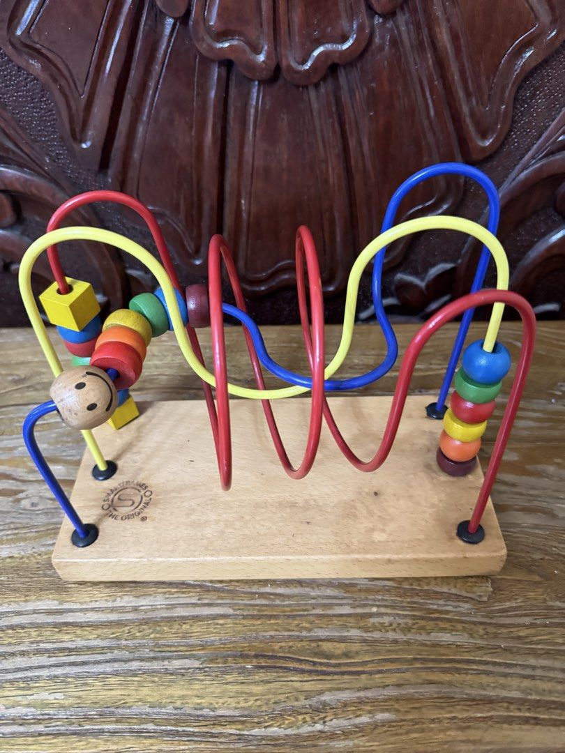Wooden Roller Coaster Bead Maze Activity Toy (Category: Educational & Learning Toys) located in Las Pinas. Submitted by emdjss (Listing ID 1470792682, Image 1). Description: - Classic wooden roller coaster bead maze - Features multi-colored beads and sliding shapes on twisted metal wires - Mounted on a sturdy wooden base with solid build quality - Excellent educational toy for toddler hand-eye coordination and motor skills - Clean wood and fully 