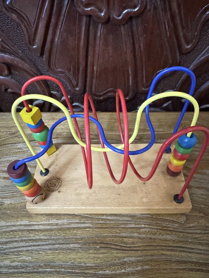 Wooden Roller Coaster Bead Maze Activity Toy (Category: Educational & Learning Toys) located in Las Pinas. Submitted by emdjss (Listing ID 1470792682, Image 2). Description: - Classic wooden roller coaster bead maze - Features multi-colored beads and sliding shapes on twisted metal wires - Mounted on a sturdy wooden base with solid build quality - Excellent educational toy for toddler hand-eye coordination and motor skills - Clean wood and fully 