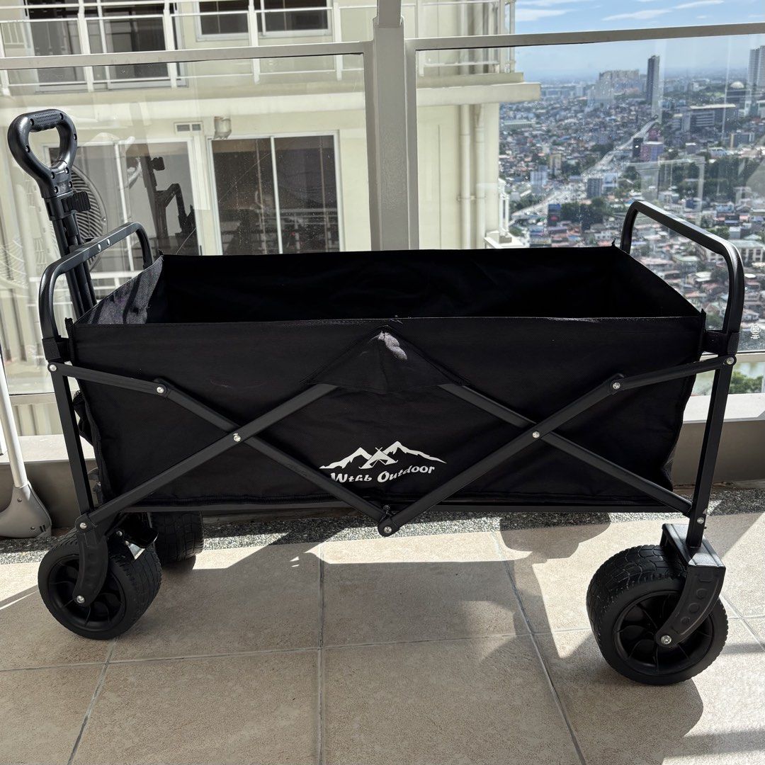Wtab Outdoor Folding Utility Wagon Black (Category: Hiking & Camping) located in Pasig City. Submitted by zemira.elaine (Listing ID 1470793948, Image 1). Description: Issues: a little rusting on the metal near the front wheels Rfs: need a bigger wagon for my toddler/groceries, etc..