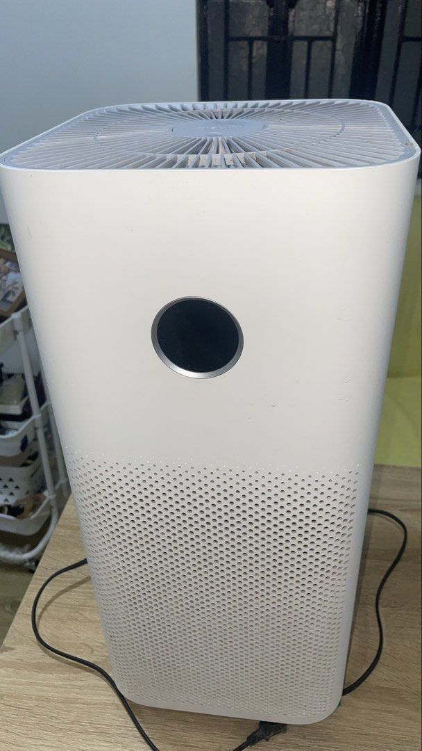 Xiaomi Air Purifier White (Category: Air Purifiers & Dehumidifiers) located in Manila. Submitted by astrida21 (Listing ID 1470892051, Image 2). Description: - Brand: Xiaomi Air Purifier (White) - Display: Circular OLED panel on the front - Design: Perforated lower grille intake and top concentric fin exhaust - Performance: Keeps room air clean and fresh, operates quietly on low settings - Inclusions: Power cord included - Condition: Excellent wor