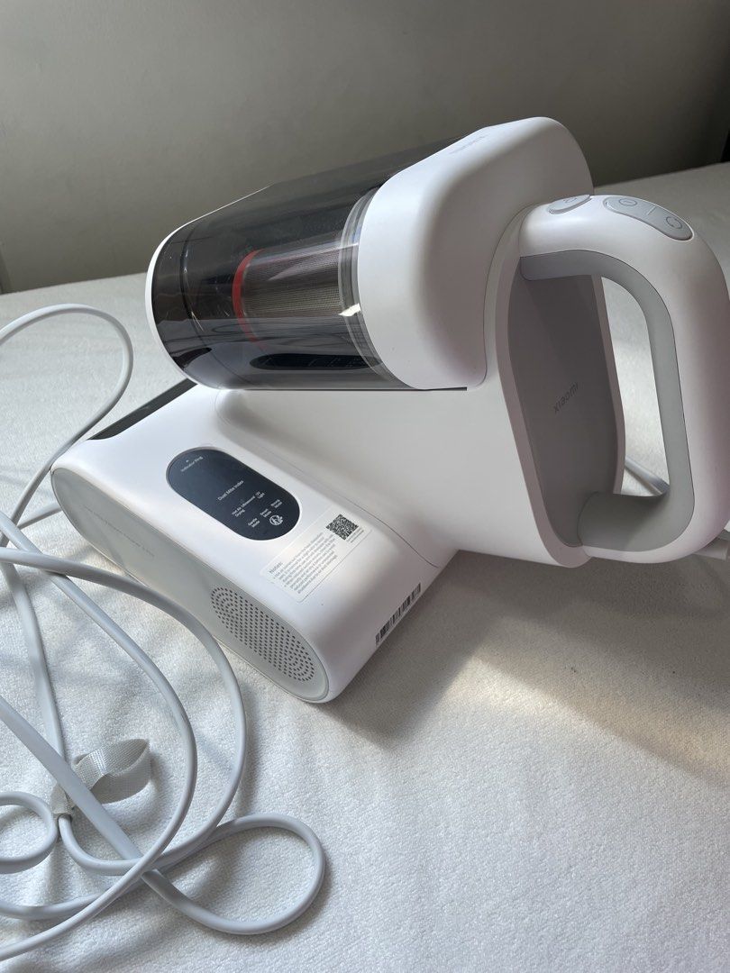 Xiaomi Dust Mite Vacuum Cleaner 2 Pro (Category: Vacuum Cleaner & Housekeeping) located in Dasmarinas. Submitted by yurisee (Listing ID 1470752560, Image 2). Description: - Product: Xiaomi Dust Mite Vacuum Cleaner 2 Pro (White) - Condition: Fully functional and clean, with only minor dust inside the container from testing - Key Features: Anti-tangle roller brush, hot air drying, UV light sterilization, and multiple suction modes - Power: Corded e