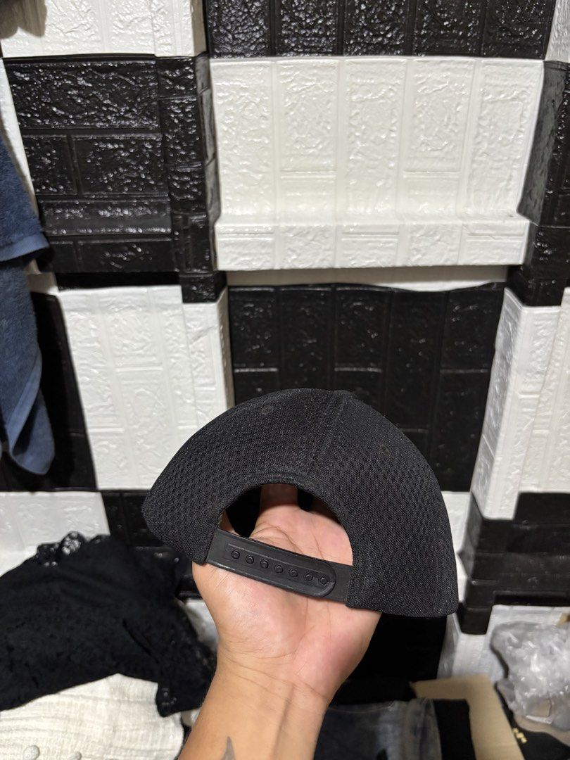 Y-3 Black Snapback Cap with Debossed Logo (Category: Caps & Hats) located in Lopez. Submitted by thrift.ni.roms22 (Listing ID 1470760168, Image 3). Description: Black Y-3 cap with a tonal debossed logo front panel. Breathable mesh side and back panels with ventilation eyelets on top. Adjustable plastic snapback closure in the back. Minimalist streetwear piece, goes with everything..